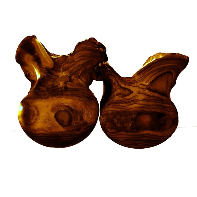 A pair of hand turned and carved sculptural wood vessels with live edge raw rims. Handmade by renowned artist Arturo...