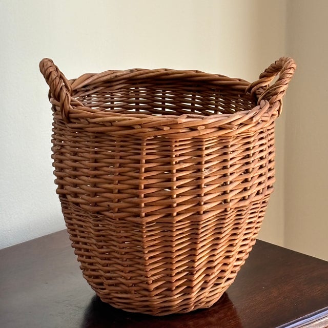 Love the classic shape of this small, round European planter basket from the mid-20th century. It features pretty French...