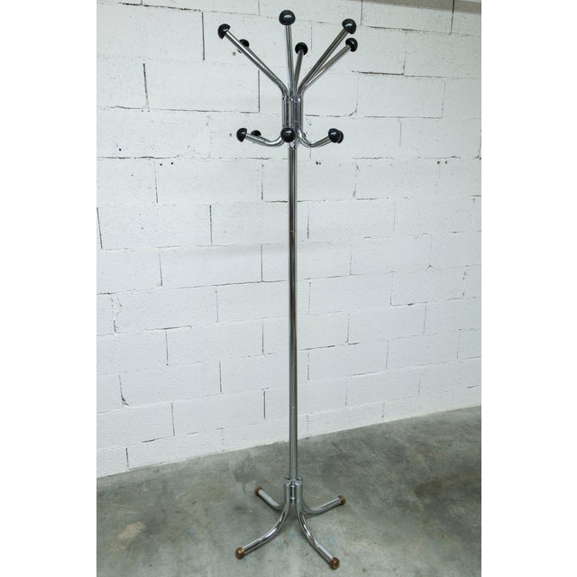 Vintage 1960s rotating industrial coat rack with 12 chrome hooks and plastic half-spheres. The chrome is clean, and the...