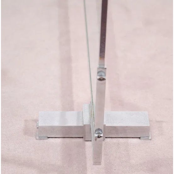 A French modernist fire screen in nickeled bronze and glass by Jacques Adnet, circa 1929.