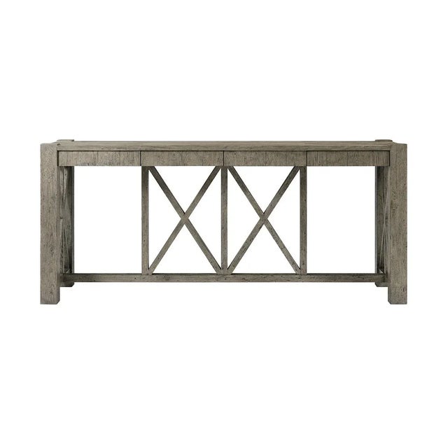 Featuring a planked oak top finished in a greyed echo oak, this console table is lightly distressed to enhance its warm,...