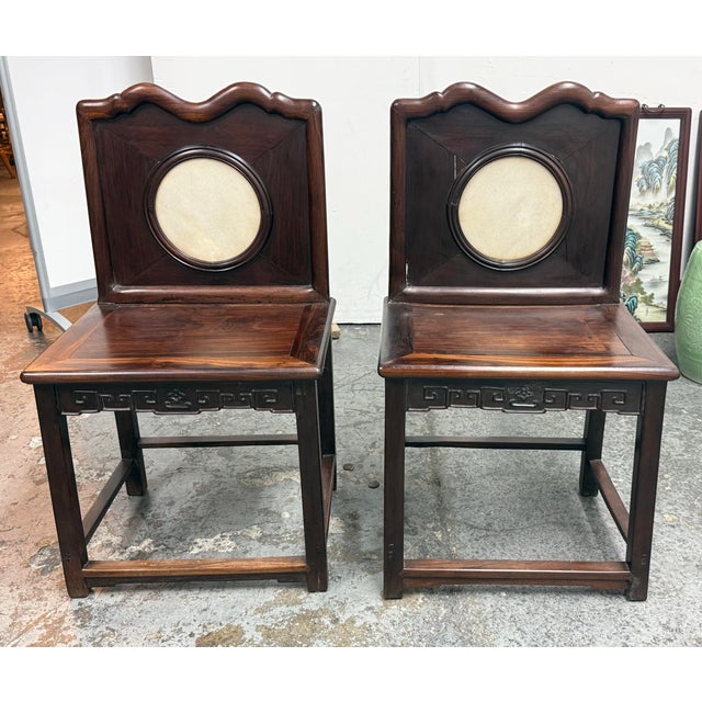 Design Plus Gallery presents a Pair of Antique Chinese Rosewood Side Chairs. These traditional Chinese chairs showcase...