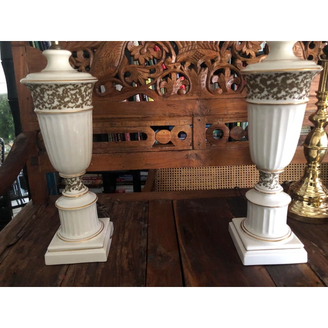 A striking rare antique pairs Tyndale lamps made by the prominent Frederick Cooper from the early 20th century adorned...