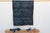 A masterwork of Malian textile heritage featuring deep indigo saturation and symbolic geometric motifs. Originating from...