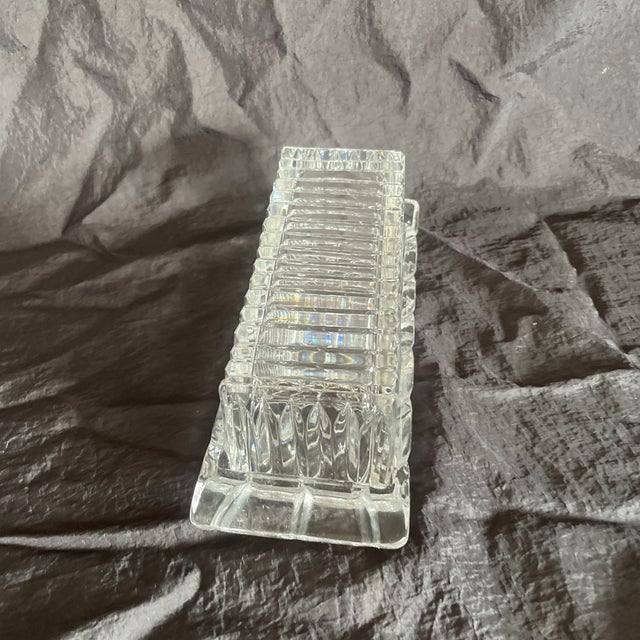 Heavy, clear pressed glass with vertical ribs or flutes running along the length of the rectangular lid. Base is matching...
