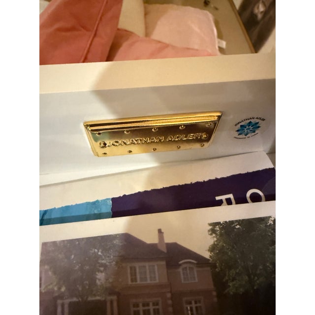 Jonathan Adler Globo Console The Globo Console features a glossy white lacquer cabinet with a brass framework and dotted...