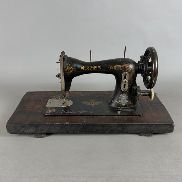 A rare and charming vintage table-top sewing machine, produced by the renowned German manufacturer Wertheim (Frankfurt am...