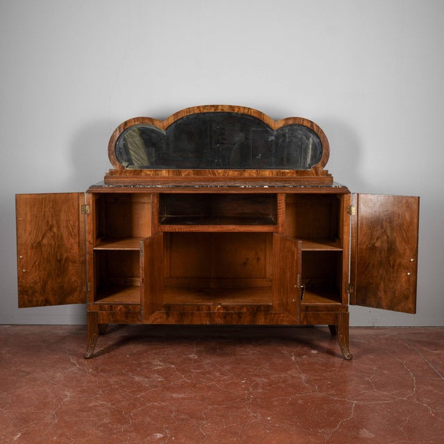 Discover this vintage sideboard, a piece of furniture that combines functionality and elegant design, typical of the art...
