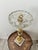 Hollywood Regency metal and glass smoke stand. Base is made of marble and all the metal has been gilded. A beautiful...
