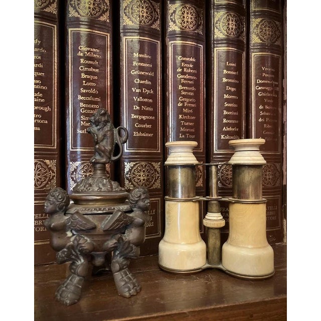 Decorative late 19th century patinated bronze inkwell executed in the Italian Renaissance taste. The central lidded vessel...