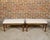 A pair of English oak rectangular stools from the 19th century with turned legs raised on arrow feet and custom...