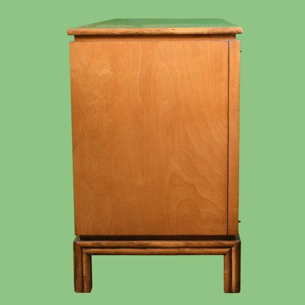 A stunning faux-bamboo and rattan credenza by Ficks Reed, a maker prized for quality rattan furniture. Three cabinet doors...