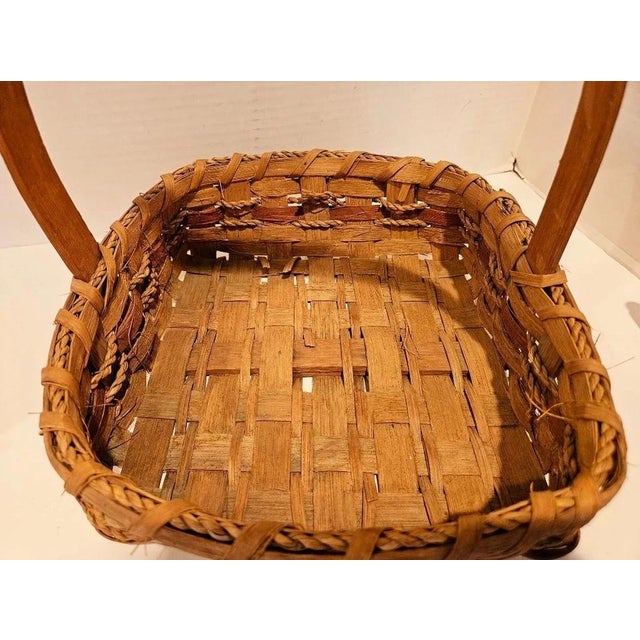 Add timeless rustic charm to your home with this Vintage Handmade Woven Natural Wood Basket with Handle. Featuring a...