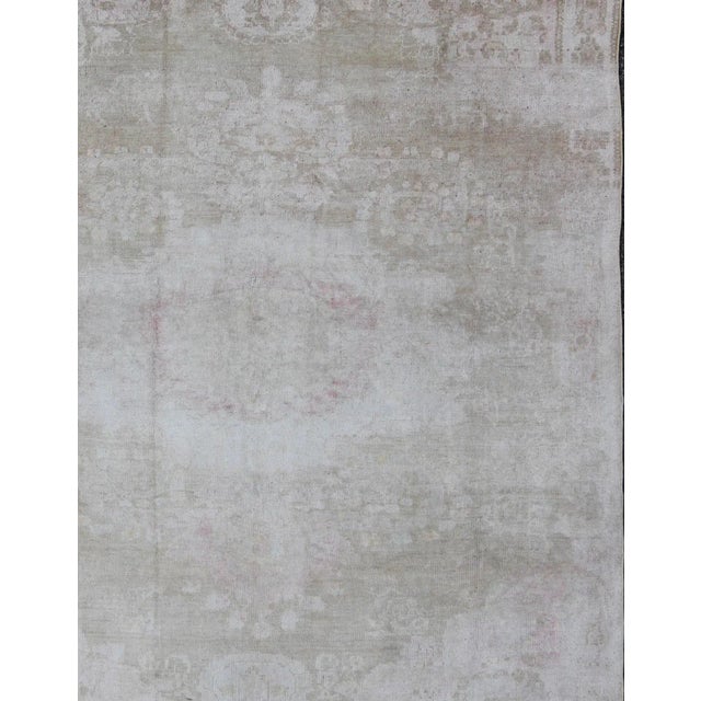 Antique Turkish Konya Area Rug in Gray & Soft Pink with Subtle Design Measures: 7.3 x 8.8 This intricate antique Turkish...