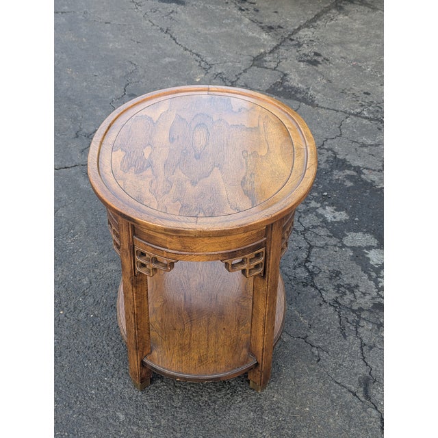 Elevate your interior with this striking Brandt 1970s Asian-inspired oval end table, a masterclass in Mid-Century...