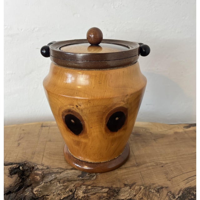 This wonderful vintage-turned wood caddy, with an attractive lid and handle, has a natural wood finish in the design,...