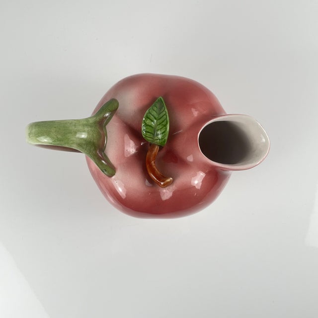 Apple-shaped earthenware pitcher, 1960s/70s The color is more red/purple in reality. Dimensions: 20 x 13 cm Height: 16 cm...