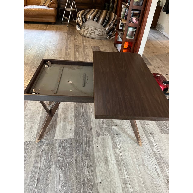 mid-century modern marvel of functional design. This vintage metamorphic table effortlessly shifts to maximize space in...