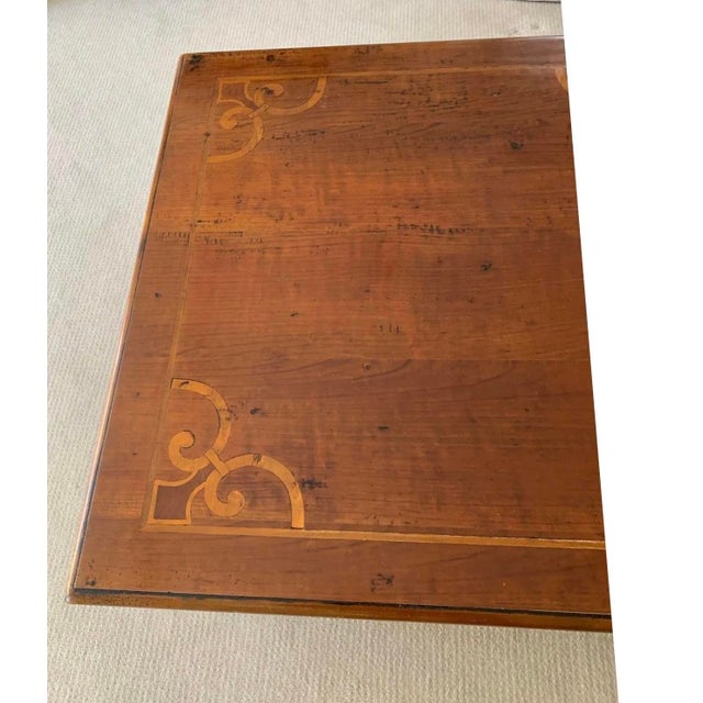 A nicely proportioned antique rectangular coffee table with lovely patina and a refined satinwood banding and inlaid...