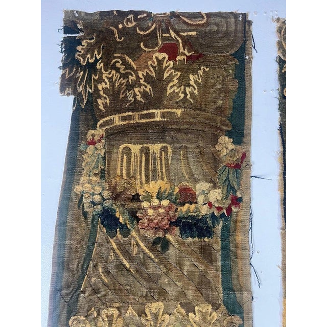 Pair of 18th C. tapestry panels featuring intricate and richly detailed designs. They display classical motifs, including...