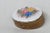 This lovely Pill Box is made of porcelain, and metal. This beautiful small pill box has white, gold, multi color flowers....