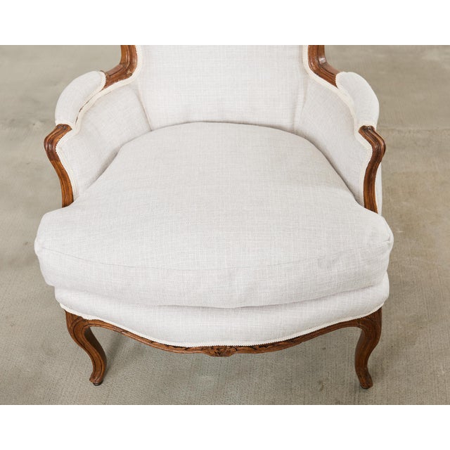 Pair of French Louis XV Style Walnut Bergeres With Linen For Sale - Image 9 of 18