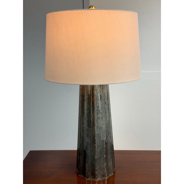 Design Plus Gallery presents the Caleb Table Lamp from Bassett Furniture. The fluted, obelisk-shaped base displays mercury...
