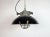 Industrial hanging lamp manufactured by Elektrosvit in former Czechoslovakia during the 1960s. It features a black enamel...