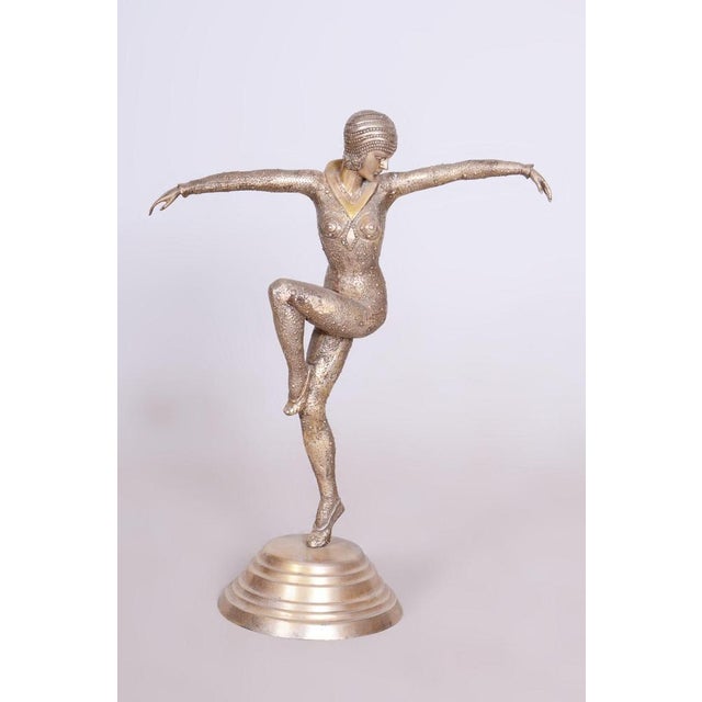 This statue of a dancer is the embodiment of the elegance and movement that defined French Art Deco in the 1930s. It was...