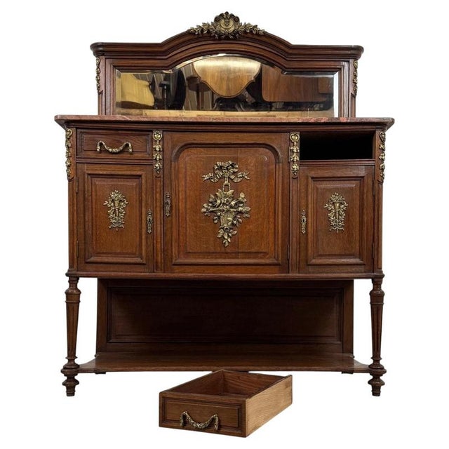 An exceptional matching pair of 19th-century French cabinets, finely crafted from oak and distinguished by their polished...