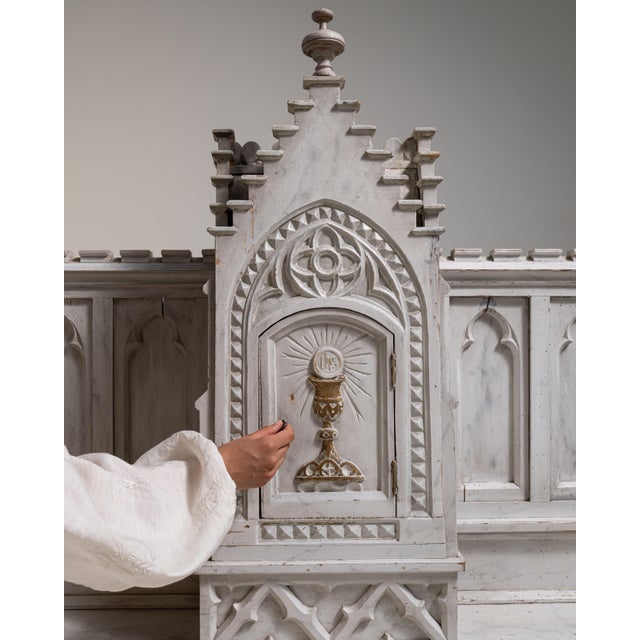 This 19th century Gothic decorative object from France is finished in antique white, worked in wood. Its design carries...