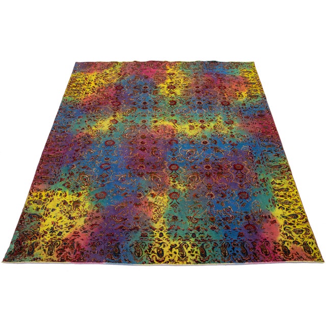 This multicolor antique hand-knotted Persian wool rug has an all-over floral design accent. This rug measures 7'3'' x 9'10".