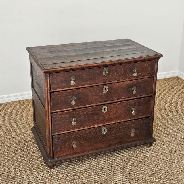 Dimensions:&nbsp;35.75"W x 21.75"D x 31.25"H A beautifully timeworn antique oak dresser, rich with deep patina, hand-...