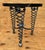These striking side tables feature bold, sculptural spiral legs crafted from heavy steel, paired with distinctive aluminum...
