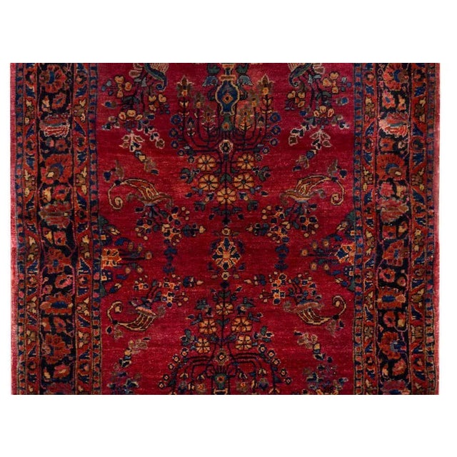 A beautiful early 20th century Persian Sarouk Mohajeran rug with a mirrored tree-of-life pattern woven in indigo, cream,...