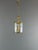 An elegant Louis XV style cylindrical lantern in gilt bronze, decorated with scrolls, volutes, and foliate motifs. The...