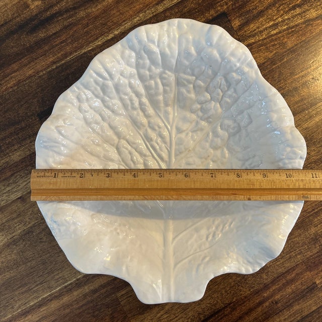 Beautiful Portuguese Majolica serving bowl featuring the classic cabbage leaf design in an elegant white glaze. Crafted by...