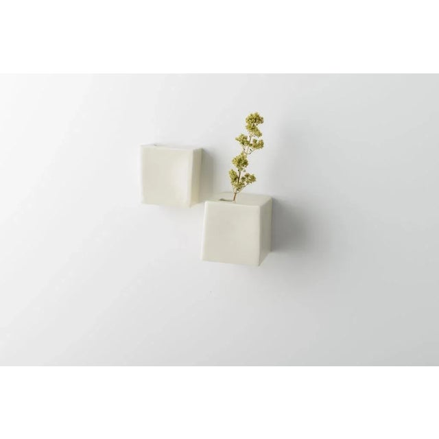 Small, elegant, funny, funny jar characterized by a parallelepiped form. Made of porcelain stoneware, made perfectly...