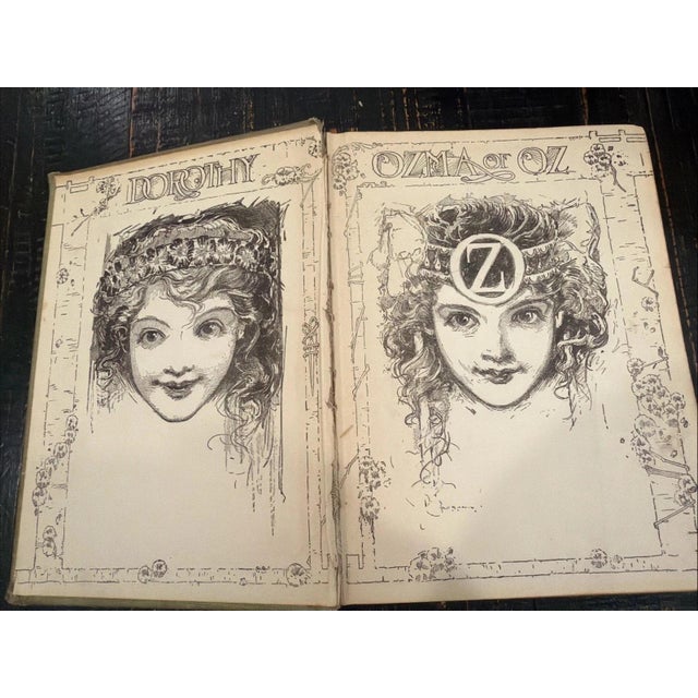 The product is a hardcover book titled "The Emerald City of Oz" by L. Frank Baum, published by Scholastic, Incorporated in...