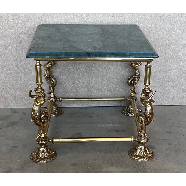 Gorgeous Gueridon or endtable with sculptures of fauns as a structure, patinated bronze and green marble top. The...