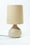 This lamp evokes the organic, nature-inspired design world of the 1970s. The handcrafted, round ceramic base features...