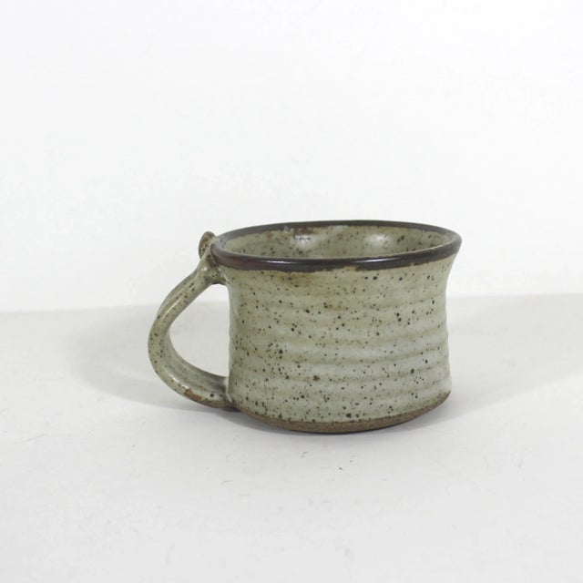 Elevate your morning cup with this unique, handmade vintage artisan studio pottery mug. This mug is truly charming. It is...