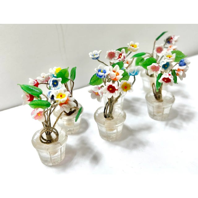 An exquisite set of miniature Czech art glass place card holders designed as delicate potted flower bouquets. Each tiny...