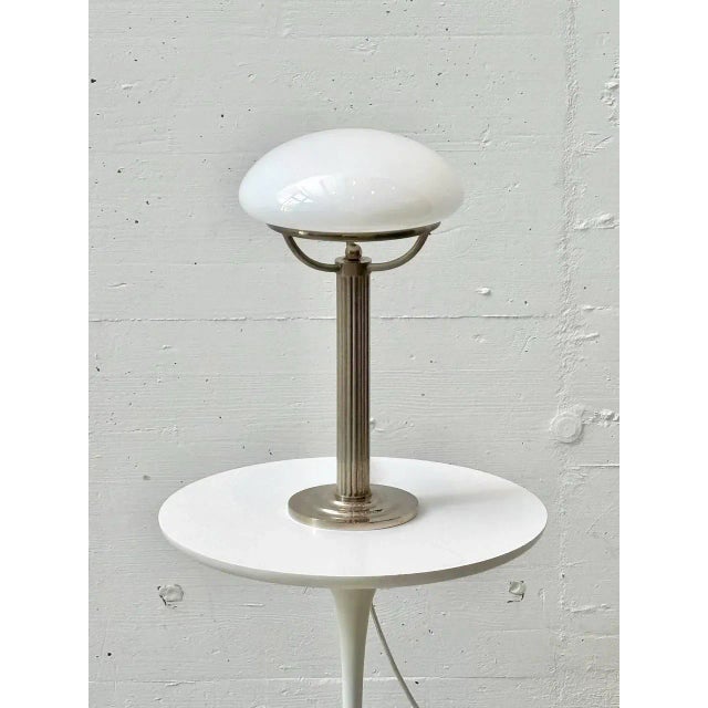 This table lamp is an expressive example of a lamp stylistically influenced by Art Nouveau and the Wiener Werkstätte, and...