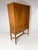 Swedish Cabinet. Birch veneer with decorative inlay. 2 large doors conceal interior adjustable shelves. 2 small drawers...