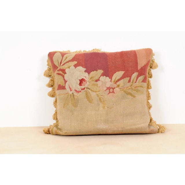 A French pillow made from 19th century Aubusson tapestry, with decor of roses and tassels. Made from an exquisite tapestry...