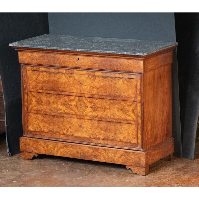 A fine Louis Philippe console chest or commode from France, of beautifully patinated burled walnut with a rectangular...