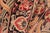 Textile Ikat Floral 1990's Pak-Persian Black/Red Wool Rug - 6'0'' X 9'5'' For Sale - Image 7 of 9