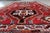 A striking handmade vintage Persian Shiraz rug, dating from the 1940s, showcasing a bold tribal design and a rich,...