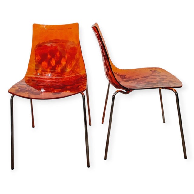 One of the most iconic pieces from the Italian brand Calligaris: the "Ice" chair. Featuring chrome-plated metal legs and a...